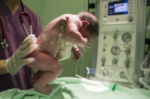 Nurse holding a newborn