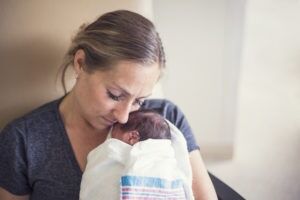 mother-holds-newborn-with-hypoxic-ischemic-encephalopathy